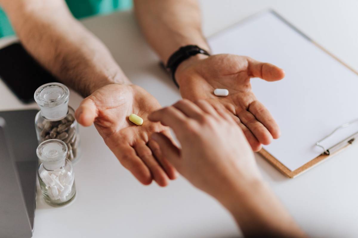a person holding pills