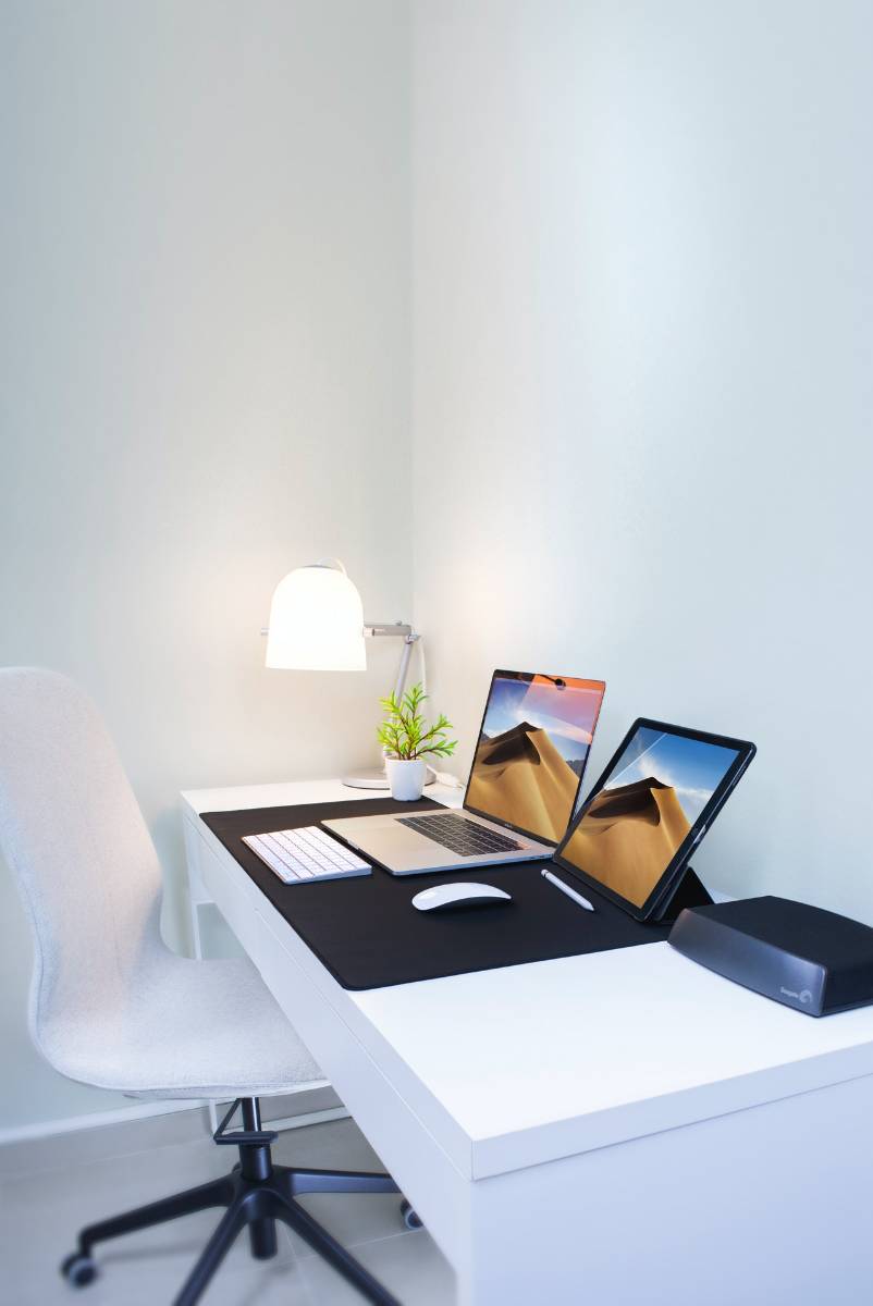 a laptop and a tab on a table